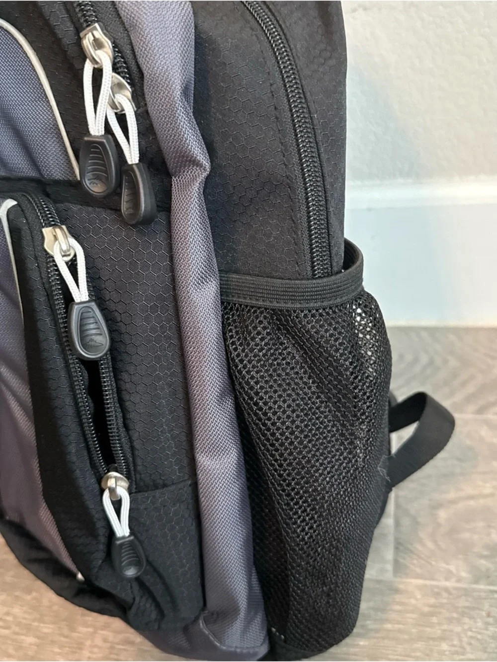 High Sierra Black and Gray Backpack with Blue and Orange Logo
